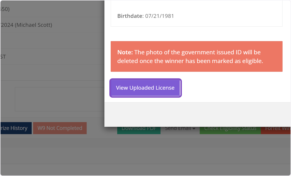 To view the uploaded photo of the winner's ID, click
