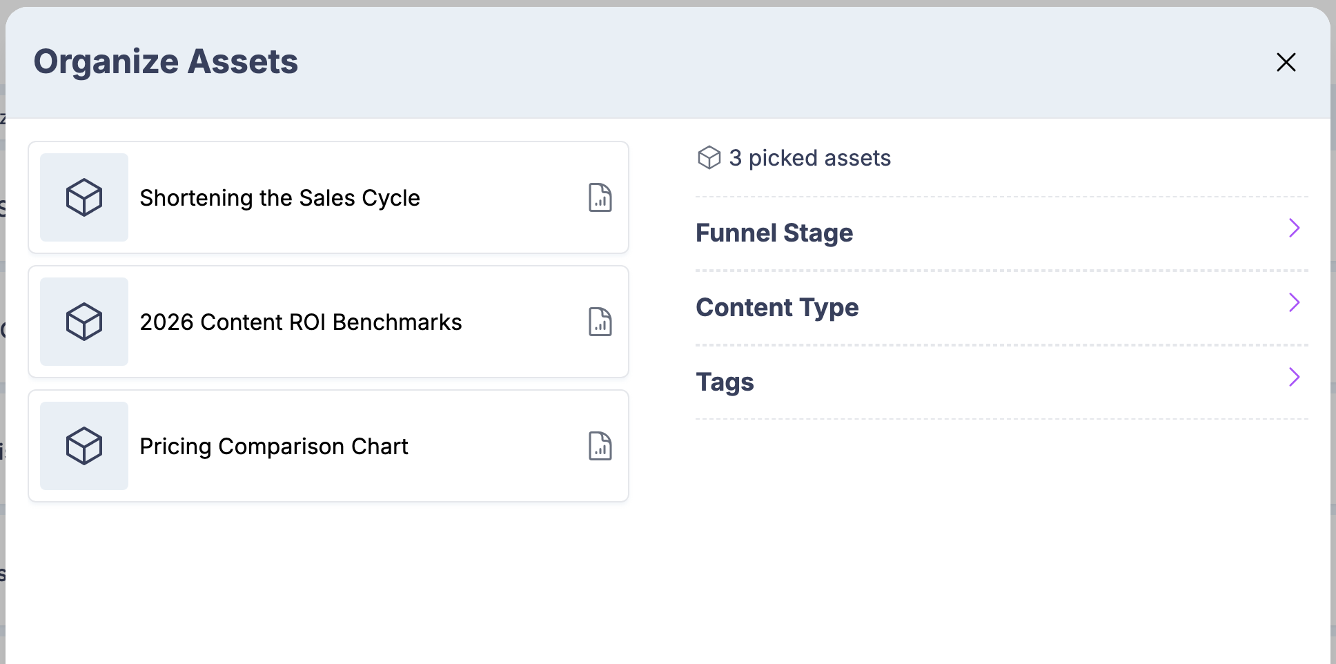 The Organize Assets panel applying content organization to three selected assets